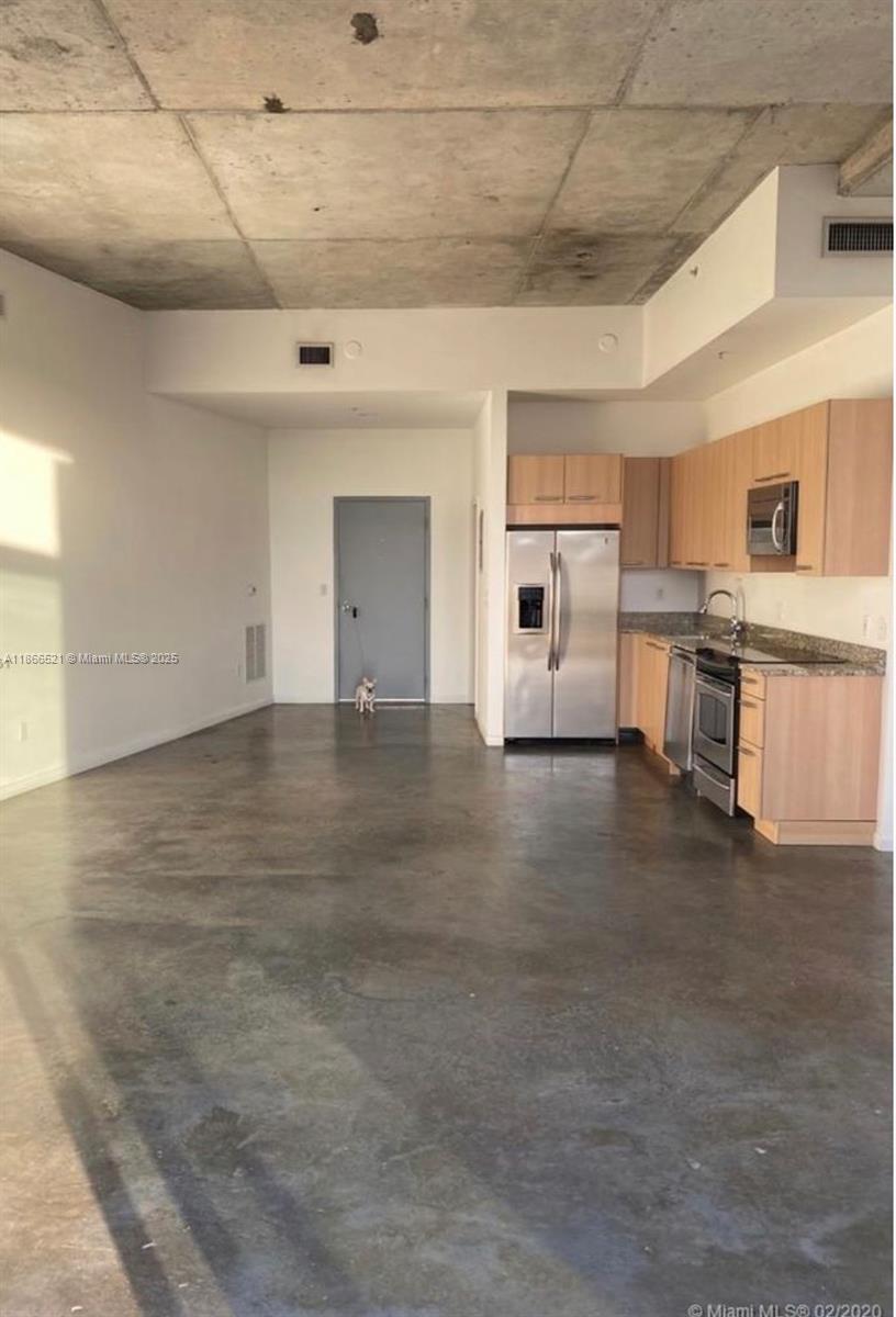 Largest 1 bedroom unit with separate living area (1145 square feet) in the Building with a Full and Half bathroom. Unit include Stainless Steel Appliances, AC system, Washer and Dryer, and one covered Parking space. Modern and Contemporary Loft Style Building on a quiet street across a Golf course in a desired neighborhood. The private balcony faces the Miami Beach Botanical Garden. Walking Distance to the Ocean, Lincoln Road and Collins Avenue. Rooftop Pool and Jacuzzi, Gym and 24-Hour Concierge. Pet Friendly Building.