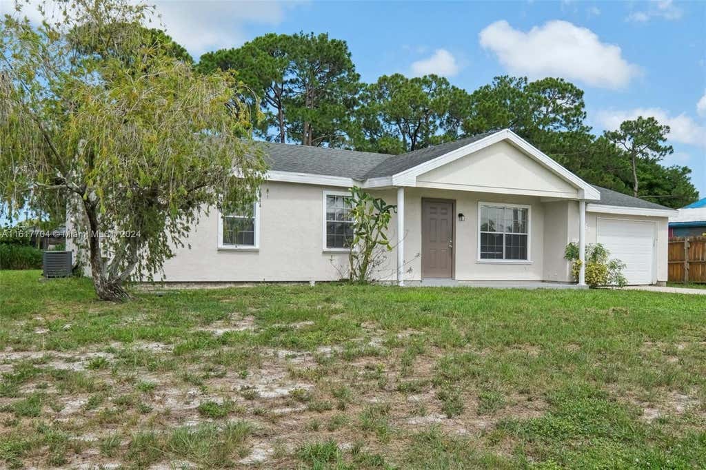 Photo of 1951 SE Aneci St, Port Saint Lucie, FL 34983 (MLS # A11617704)