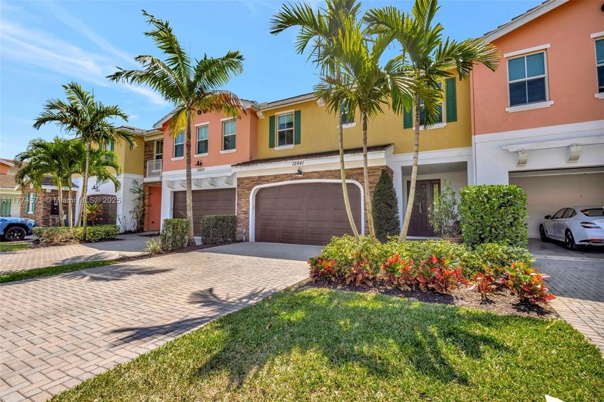 This upgraded 3-bed, 2.5-bath townhouse sits in the most desirable spot in the community—at the top of the neighborhood lake in a quiet cul-de-sac. Enjoy stunning lake views from the master suite and the largest fenced-in backyard, perfect for families. Built in 2021, this home features luxe laminate flooring, hurricane-impact windows, and a modern farmhouse kitchen with quartz countertops. Custom upgrades include a redesigned living room accent wall with an electric fireplace, a lavishly remodeled children’s bedroom, and a two-car garage with gym-grade flooring. Located in a gated Palm Beach Gardens community with a gym and year-round pool, it’s in an A-rated school district and steps from Alton’s shopping and dining. Don't miss this rare gem—schedule a showing today!