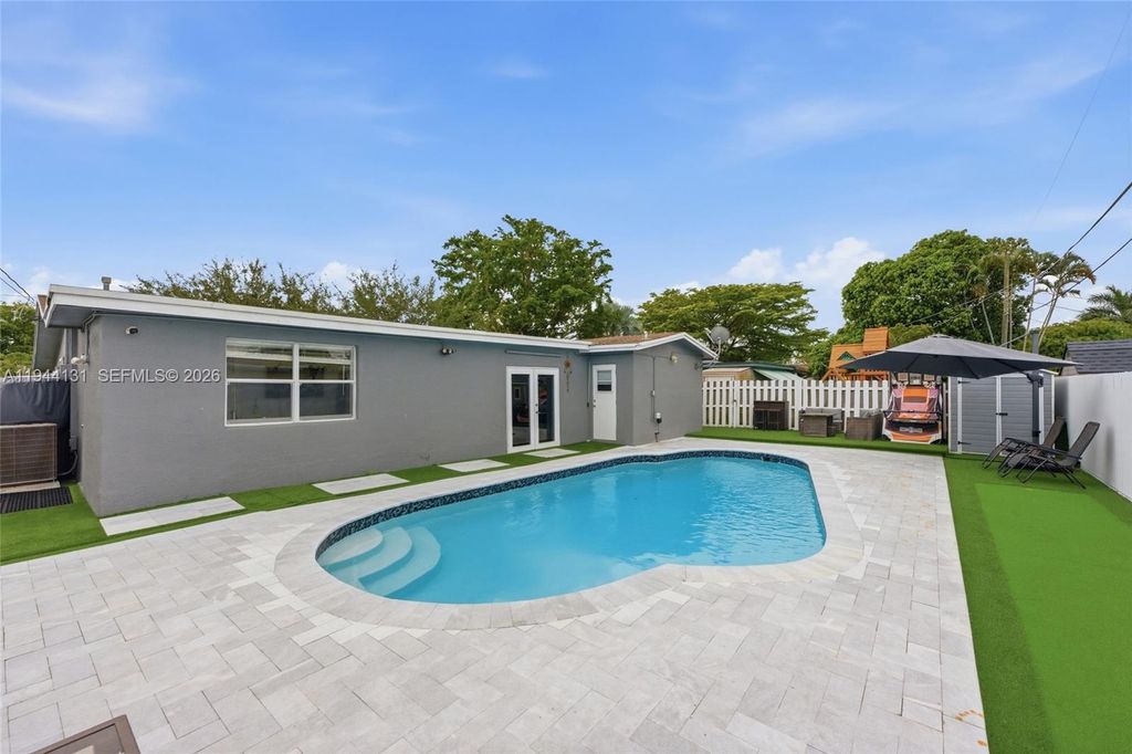 Photo of 9771 NW 24th Pl, Sunrise, FL 33322 (MLS # A11944131)