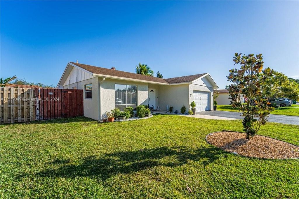 Photo of 9841 NW 24th St, Coral Springs, FL 33065 (MLS # A11539069)
