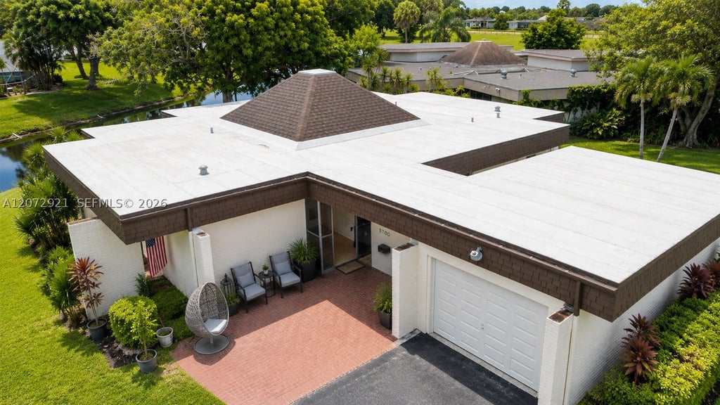 Photo of 5700 White Hickory Cir, Tamarac, FL 33319 (MLS # A12072921)