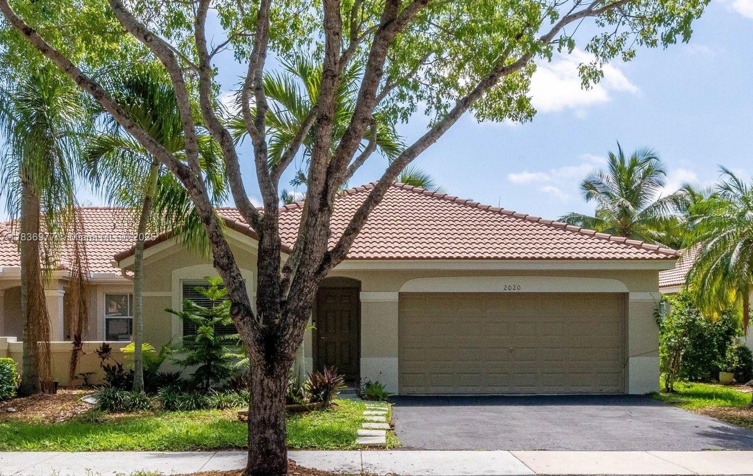 Lovely villa in the highly sought-after community of The Hammocks in Weston. Features 3 bedrooms and 2 full bathrooms, a two-car garage, and a beautiful patio with a lovely view of the lake. This villa has tiles throughout all living areas and new water-resistant vinyl floors in all bedrooms. It has a huge dining/living room area with high volume ceilings, a large kitchen with newer appliances and upgraded cabinets. Full-size Top of the Line front-loading Washer and Dryer. The 2nd bathroom has been completely renovated. It has plenty of closet space. Residents of The Hammocks have access to all the amenities of Savanna: a clubhouse with swimming pools (one of them an Olympic-size pool), a basketball court, pickleball, and more amenities. Short distance to park, schools, shopping, and more!