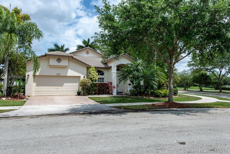 Welcome Home! Best schools in Weston, Beautiful 4 bedroom 2 bath home in Emerald Estates, 2 split floorplan separates the master suite, upgraded kitchen with Stainless Steel Appliances and Granite Countertops, Hurricane Shutters throughout.  Home is sitting on a corner lot with plenty of space for a pool.  The association fees include your property landscaping, High-Speed Internet, Basic Cable, Sprinklers systems maintenance (including water for the sprinklers), wireless security system and monitoring, Community pool, playgrounds, and fully equipped gym, 24x7 guard gated security and property manager on site.