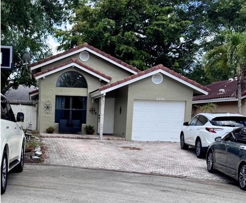Photo of 2370 NW 122nd Dr, Coral Springs, FL 33065 (MLS # A11776208)