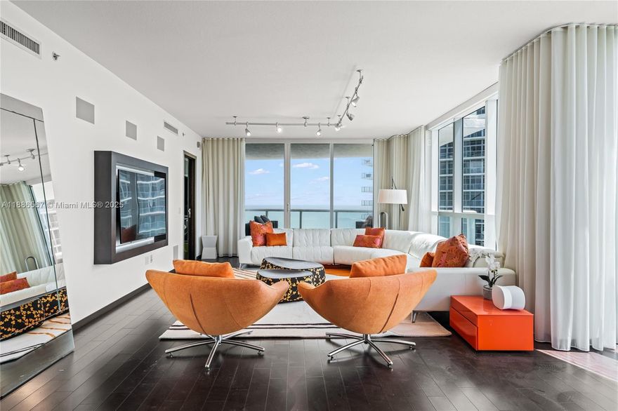 Experience the best of Miami Beach in this oceanfront corner residence, offering a rare flow-through layout with sweeping views of the Atlantic and downtown skyline. This 3-bedroom, 3-bath home is finished with elegant designer details, a gourmet kitchen, and custom built-ins throughout. Private elevator entry opens to light-filled interiors and two expansive terraces, perfect for enjoying sunrise to sunset. Residents enjoy five-star amenities, including a state-of-the-art fitness center, infinity-edge pool, beach and poolside service, concierge, and 24-hour security.