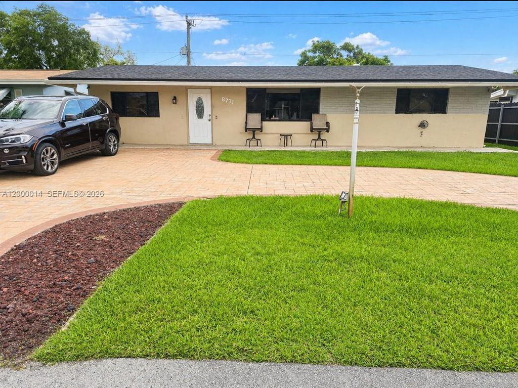 Photo of 8771 NW 15th Ct, Pembroke Pines, FL 33024 (MLS # A12000014)