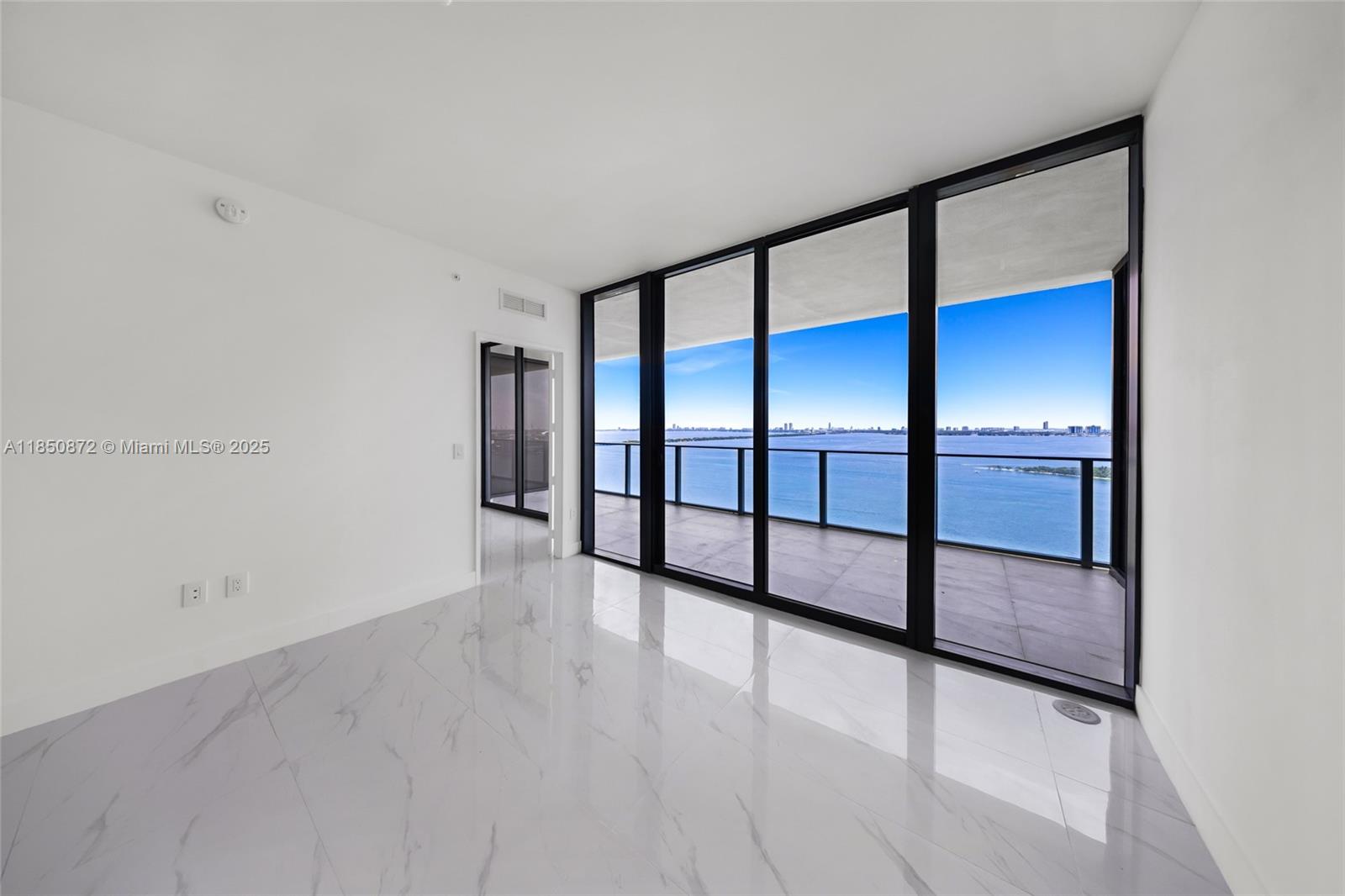 Experience elevated luxury at Aria Reserve South Tower in Miami’s Edgewater. This brand-new 2-bed + den, 3-bath, 1,783 SF residence in the sky with private elevator access offers seamless indoor-outdoor living and stunning east views of Biscayne Bay sunrises and vivid sunset panoramas. Enjoy 10-ft ceilings, impact glass & designer finishes throughout. The open living area flows to a deep terrace. A gourmet kitchen with Thermador appliances is ideal for entertaining. The primary bedroom features a spa-like bath & walk-in closet. The den offers flexible space for a home office or guest room. Includes Two Parking Spaces. Resort-style amenities: bayfront and sunset pools, tennis & pickleball courts, gym, restaurants, kids’ playroom, dog parks, 24/7 concierge. Live where luxury meets the bay.