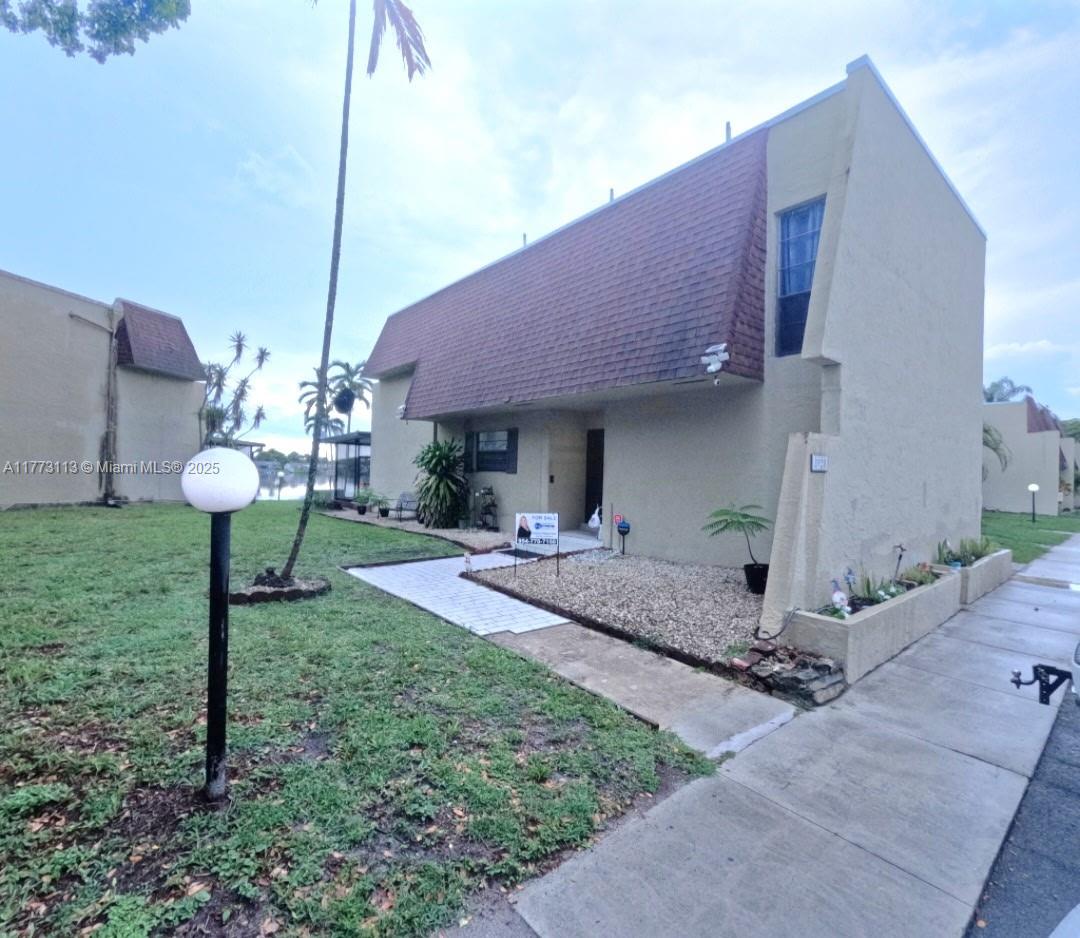 Fabulous 4 bd/2.5 bath townhouse in the heart of Pembroke Pines! This home has been completely renovated along with spectacular custom designs throughout, including a custom panty & storage closet under the stairs. You will appreciate cooking in your spacious kitchen while your guests gather in the beautiful dining area. A sunken living/family room offers you an open area to entertain or enjoy a fun filled movie night. Relax in your back patio which features a full kitchen and beautiful lakeview. A Guest room downstairs along with a half bathroom. There are 3 additional bedrooms upstairs and 2 full bathrooms, which includes a huge master bedroom offering you a cozy balcony with a tranquil lakeview. With so many other features to mention this is a MUST SEE!! MAKE YOUR APPT TODAY!