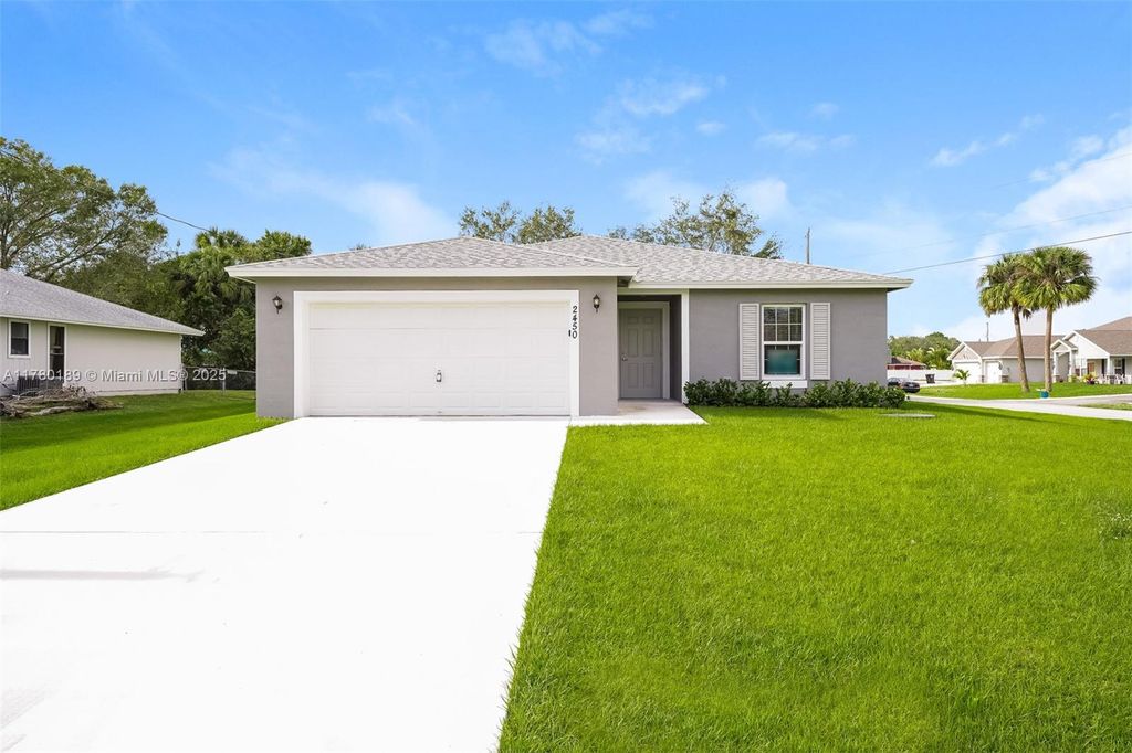 Photo of 2450 SW Madiera St, Port Saint Lucie, FL 34953 (MLS # A11780189)