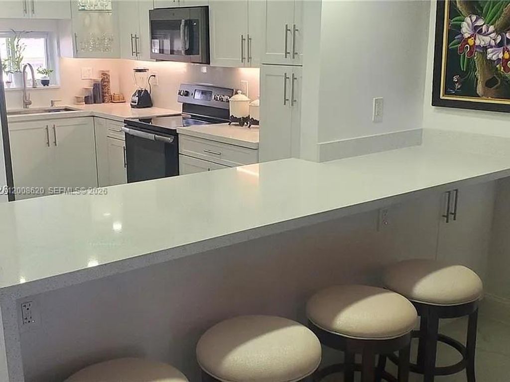 Photo of 9720 S Hollybrook Lake Dr #303, Pembroke Pines, FL 33025 (MLS # A12008620)