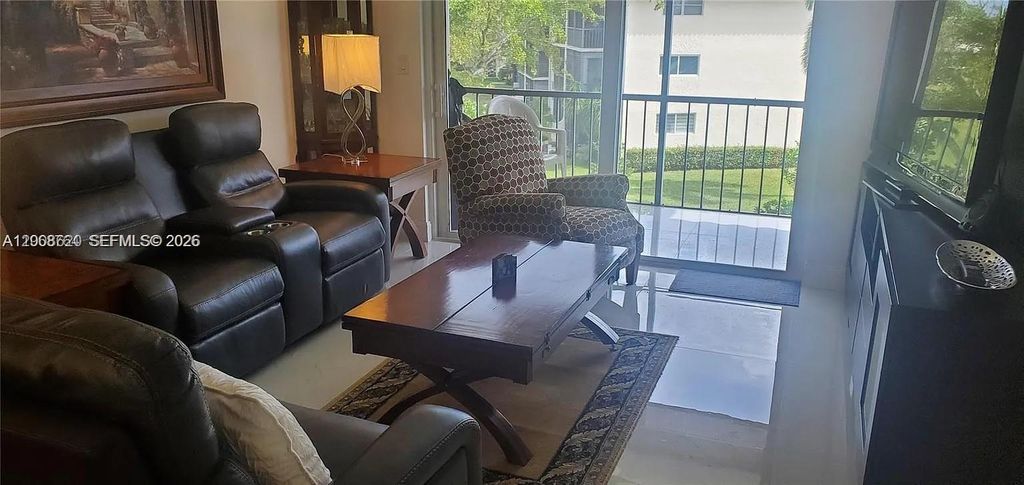 Photo of 9720 S Hollybrook Lake Dr #303, Pembroke Pines, FL 33025 (MLS # A12008620)