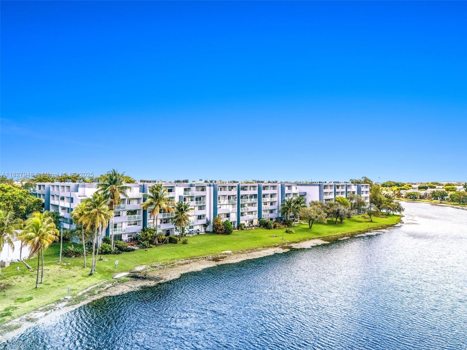 Lakeview, Corner Unit, 1BR/1.5BA w/ Spacious Balcony. Discover this beautifully maintained large condo offering peaceful lake views & a secure, well-kept complex. Whether you’re looking for a primary residence or income-producing property, this unit checks all the boxes. Enjoy the outdoors from your expansive 150 sq. ft. balcony, perfect for relaxing. The condo features tile flooring throughout, kitchen w/ granite countertops, abundant closet space & a huge laundry room for added storage and convenience. Accordion shutters provide peace of mind during storm season. Beach Club amenities: 3 swimming pools, basketball, playground, exercise room, 24 hr roving security. One assigned parking space & assigned visitor, plenty of additional visitor parking. Low HOA & taxes will help loan ratios!