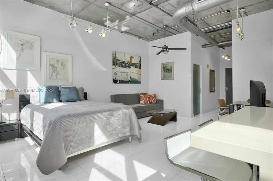 Modern NYC-loft-style studio in Cite on the Bay, located in the heart of Edgewater! This fully furnished unit features extra-high 12ft ceilings, white marble floors, an open kitchen, walk-in closet, impact glass windows, pantry, and in-unit washer/dryer. The property is tenant-occupied until July 26, 2025, making it a great investment in a prime location. Building amenities include valet, concierge, an impressive gym, pool, Jacuzzi, business center, club room with billiards, and more! Enjoy living across from beautiful Margaret Pace Park, offering a walking path, soccer fields, tennis, and volleyball courts.Walk to Publix, Miami Trolley, trendy restaurants/shops, museums, concerts, and top charter schools.Just minutes from Midtown, Wynwood, Brickell, the Design District, and Miami Beaches!