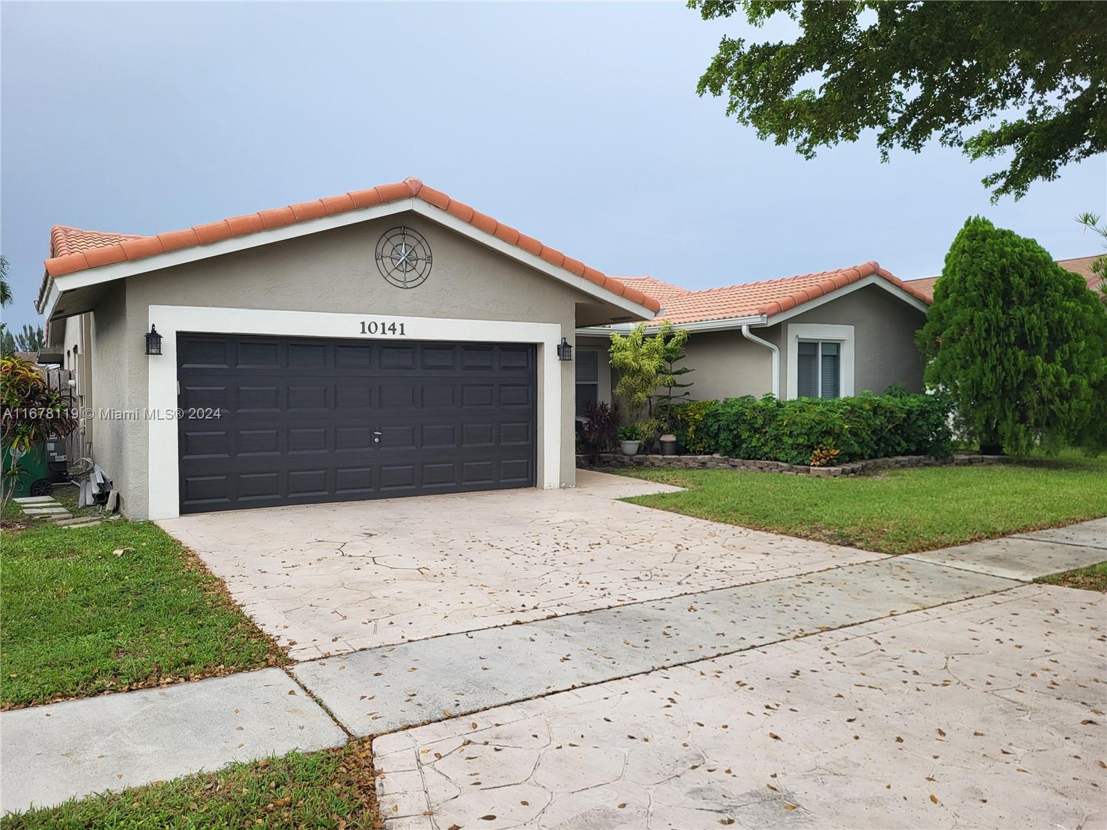 This beautiful home consists of 3 bedrooms, 2 baths and a 2 car garage. Located in Parkwood Isle in Davie. It offers a modern living with a cozy feel. Large kitchen with stainless steel appliances, quartz countertop, perfect for entertainment. Both bathrooms have been updated. Tile throughout. It also comes with full impact windows and doors. Good size backyard with room for a pool. Relax on the front porch or enjoy the privacy of the back screened porch. Perfectly located, close to 595, A rated schools and shops.