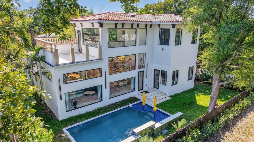 Brand New, New, New! 100% New Construction Stunning 2 Story Dream House w/ Pool and 13 ft High Ceilings! This 4 bed modern masterpiece showcases custom porcelain floors throughout and expansive windows that fill the home with natural light. The chef’s kitchen is a showstopper, featuring custom quartz countertops, a floating illuminated island with a hidden bar refrigerator, two oversized porcelain farmhouse sinks, and premium appliances including double ovens. This residence offers 4.5 spa-inspired bathrooms with custom vanity mirrors, jacuzzi porcelain tubs, and designer showers. A dramatic floating illuminated staircase anchors the home, complemented by smart TVs throughout and sleek frosted glass pocket doors in every room. Enjoy designer lighting with touch-dimmer controls, dual central A/C systems (2.5 & 3 tons). Outside your private oasis awaits with a custom 9-ft deep saltwater pool, white Italian porcelain mosaic tile, and waterfall fountain. The property is fully equipped with a sprinkler system for front and back yards, as well as a comprehensive surveillance security system with camera coverage. A rare opportunity to own a fully upgraded, luxury new construction home designed with style, comfort, and innovation in mind. A must see!