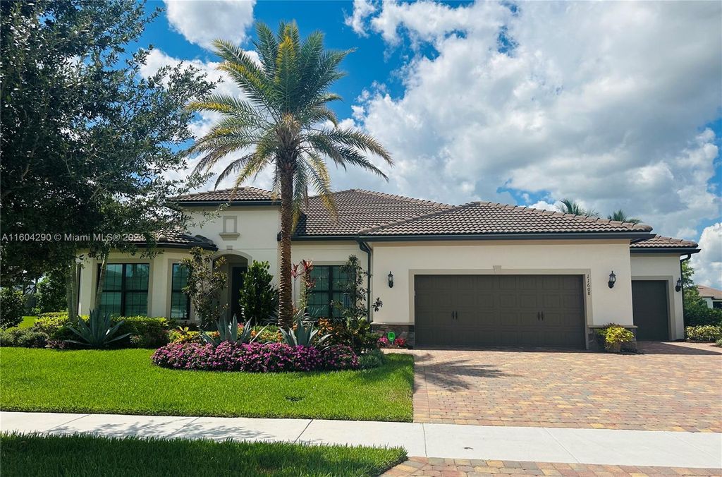 Photo of 11608 Sally Ann Dr, Palm Beach Gardens, FL 33412 (MLS # A11604290)