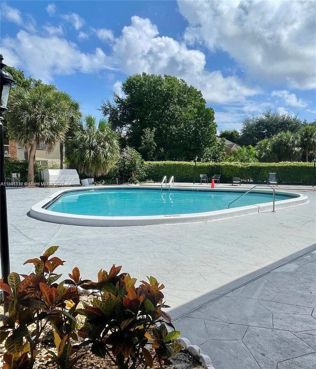 SPACIOUS GROUND FLOOR UNIT 2/2 .NEW A/C AND RANGE OVEN. TITLE FLOORS . LAUNDRY FACILITIES COMMUNITY OFFER POOL, CLUBHOUSE, GATED .PETS FRIENDLY. NO AGE RESTRICTIONS. EASY TO SHOW .