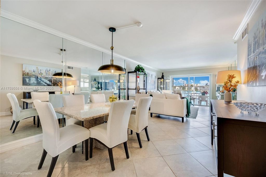 Photo of 300 Golden Isles Dr #302, Hallandale Beach, FL 33009 (MLS # A11759558)