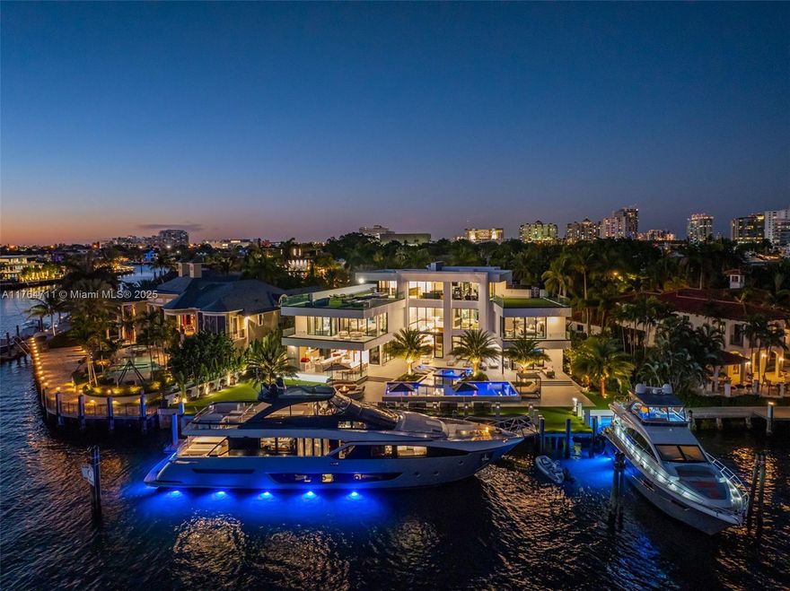 Discover unmatched luxury in this newly built estate by Crest Group & Bruce Celenski. Spanning 150 feet of prime Intracoastal frontage, every detail of this home exudes prestige. Unwind in the Turkish Bath spa, entertain in the media room, or elevate your fitness in the private gym. Culinary experiences shine with a chef’s kitchen, auxiliary prep space, and wine room. The primary suite is a retreat of its own offering an oversized suite and a spa like bathroom. Step outside to indulge in two summer kitchens, a rooftop deck with a hot tub, a pizza oven, fire pits, and a stunning pool oasis. Boaters will love the private dock and floating dock, while car collectors have room to expand with showcase garages. A home crafted for the connoisseur of fine living just minutes from the beach.