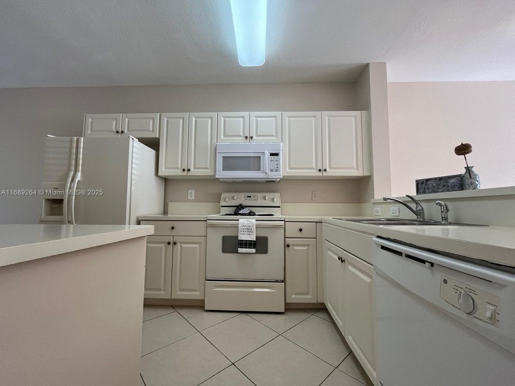 Photo of 1932 Alamanda Way, Riviera Beach, FL 33404 (MLS # A11689264)