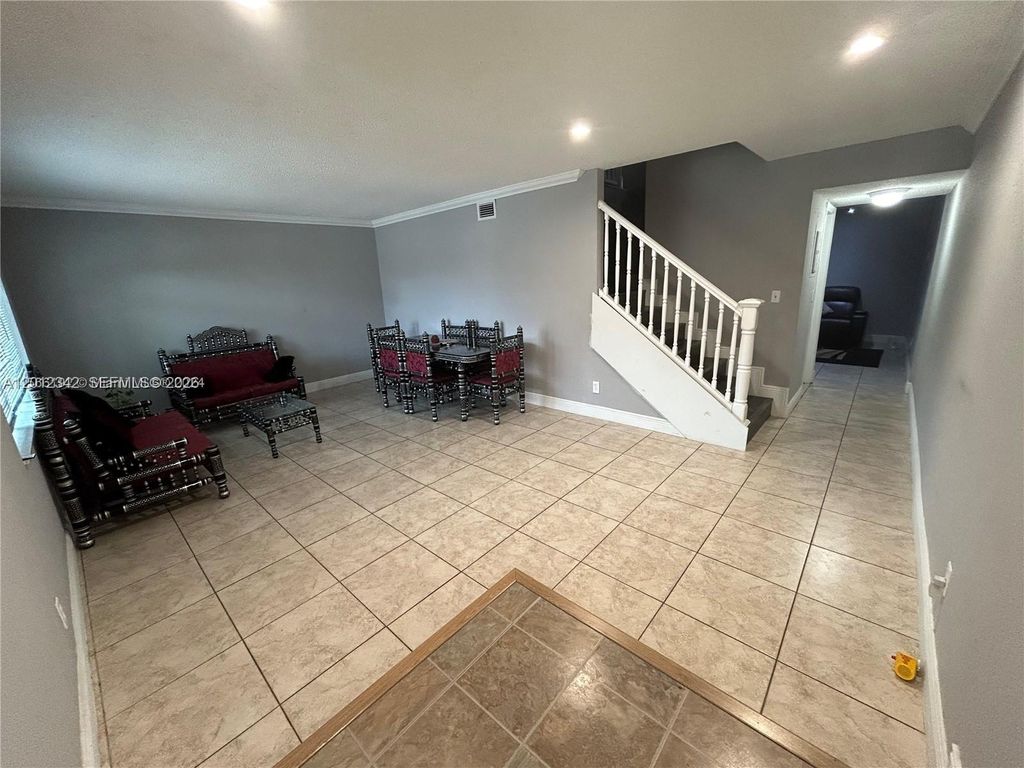 Photo of 29 Madrid Ln #8-9, Davie, FL 33324 (MLS # A12012342)