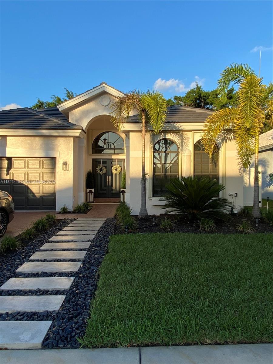Welcome to this beautifully updated home nestled in the sought-after Pembroke Shores Community. Situated in a quiet cul-de-sac, this move-in-ready residence offers both comfort and style. Enjoy the privacy of a PVC-fenced backyard with artificial turf. Inside, the open-concept layout features soaring high ceilings and a chef-inspired kitchen. Quartz countertops, a wine cooler, double oven, and ample cabinet space—perfect for family gatherings and entertaining guests. Bedrooms feature new laminate flooring and custom California closets. Impact-resistant doors and aluminum windows. Titan water heater, and new LG washer and dryer. Located near major highways. Monthly rent includes water and sewer. All other utilities are the tenant's responsibility. Schedule a viewing today!