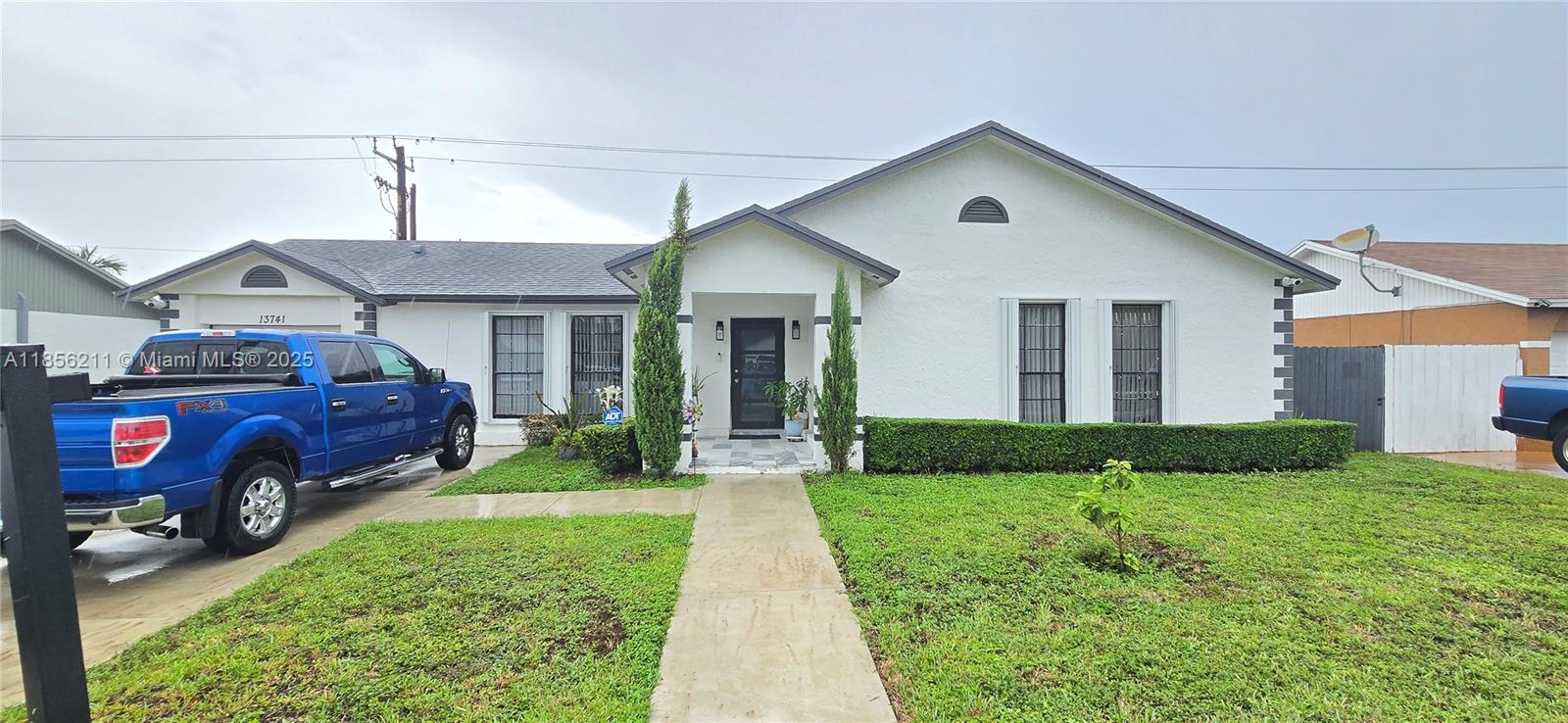 Welcome to your new home. This beautiful property features 3 bedrooms and 2 fully remodeled bathrooms. The garage has been converted into a guest apartment with 1 bedroom and 1 bathroom. New flooring throughout the property, plus a roof installed in 2019. New air conditioning and a water purification system installed throughout the house, paid in full. Enjoy the outdoors with its heated pool and beautiful tiki bar, as well as its large terrace where you can enjoy beautiful family evenings. Plenty of space to park your boat or RV. Located on Exit 6 of the Turnpike.