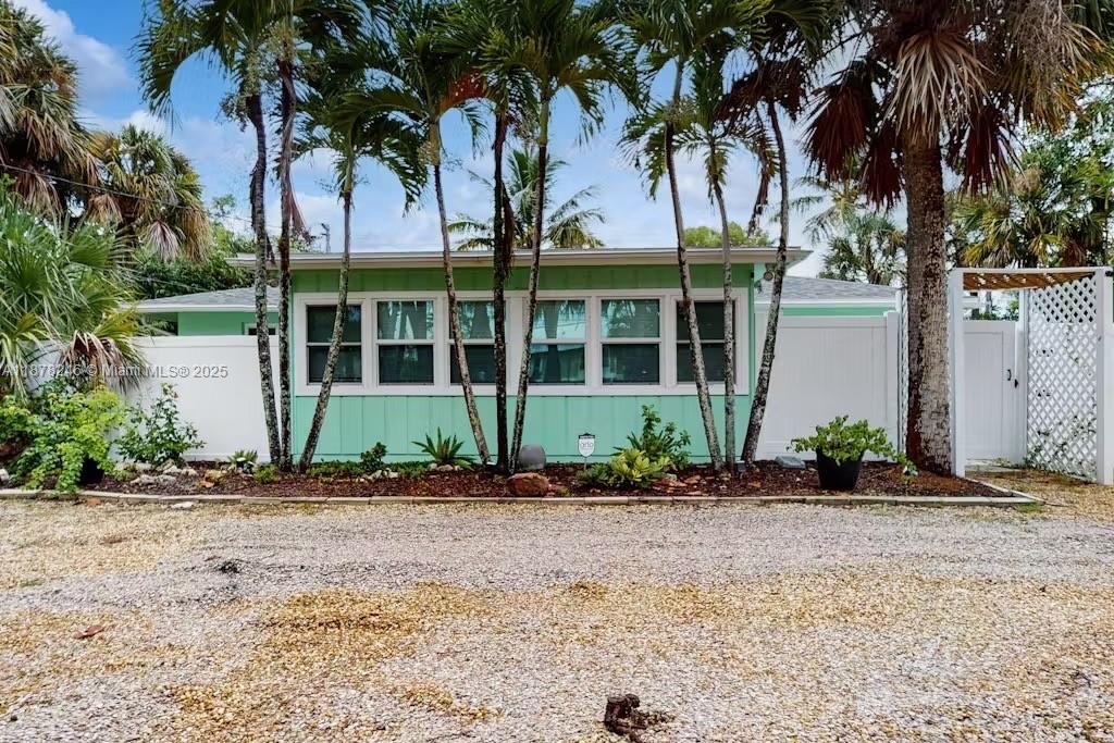 Welcome to your serene retreat on Sanibel Island, where coastal charm meets modern comfort in this fully renovated, move-in-ready home. Featuring brand-new systems and luxury vinyl plank flooring, the sunlit open-concept design is perfect for relaxing or entertaining. The stylish kitchen offers new appliances and generous counter space, while dual primary suites in a split layout provide ideal privacy for guests or family. Set on an oversized lot, enjoy outdoor living with space to garden, entertain, or unwind. Mid-island location offers easy access to beaches, shops, dining, and outdoor adventures. Live the Sanibel lifestyle—paradise awaits. Roof 2023, Windows and Doors 2023, A/C 2019. Complete Remodel 2023.