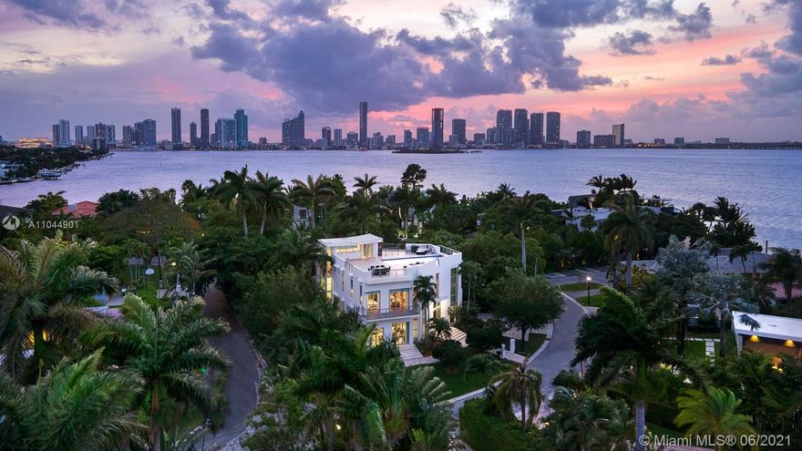 One of a kind contemporary new luxurious home w/ gorgeous 1,900 sq ft rooftop pool terrace. Sitting on a 7,500 sq ft corner lot, boasting a 15 x 30 negative edge swimming pool w/ breathtaking 360-degree panoramic views of Biscayne Bay (incl. gas, water, elec. outlets for bar/bbq/jacuzzi). Welcoming you with a 10’+ ceiling height w/ double-height entryway, elevator to all 3 floors, smart touch (color panel) lighting system, tankless gas w/h, high-end plumbing and elec. equip. Deluxe master bath: spa, sauna, bidet, all bedrooms with en-suite baths, equipped w/ Kohler infinity soaker tub, etc. Spacious playroom room under the pool is fun for kids.