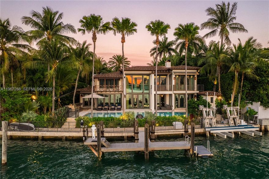 Casa Mare is a masterfully reconstructed waterfront estate on the Venetian Islands, offering the pinnacle of direct open-bay & Downtown skyline views with spectacular sunsets. Arrive to tropical gardens, koi ponds, water features, and a meditation/yoga deck. 22-ft ceilings welcome you in the living room, with detailed finishes throughout - French oak and travertine floors, brass inlay doors, and pearled Venetian plaster. Warm and serene, it blends Art Deco Mediterranean design with subtle Asian influences. Enjoy a heated pool, summer kitchen, and approx. 110’ of waterfront w/dockage for a 90’ yacht. Includes a generator, state-of-the-art A/V & security cameras, UV filtration system, onyx bar, gated entry, 2-car A/C garage with EV charger, primary balcony jacuzzi, & guest house.