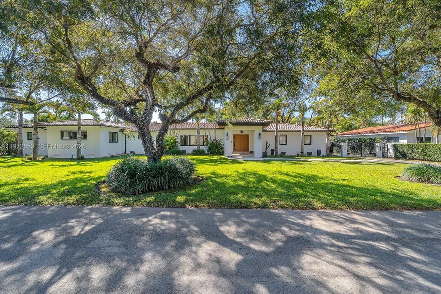 Welcome to Casa Algardi, a magnificent residence nestled on a massive 16,500 square foot parcel on one of Coral Gables’ quiet, tree lined streets. This beautifully updated 3 bedroom 3 bath home has been recently redone with all new flooring, surround sound system, brand new impact windows and doors, and a stunning custom pivot entry door that creates an impressive first impression. The home offers spacious light filled living areas, a modern kitchen with quality finishes and ample cabinetry, generously sized bedrooms including a well appointed primary suite, and a beautiful outdoor veranda overlooking the heated salt water pool, perfect for relaxing or entertaining. A spacious 2 car garage adds convenience and functionality, while the expansive yard is surrounded by lush landscaping offering privacy and tranquility, all just minutes from fine dining, shopping, parks, and top rated schools, making this move in ready residence a rare opportunity in the heart of Coral Gables.