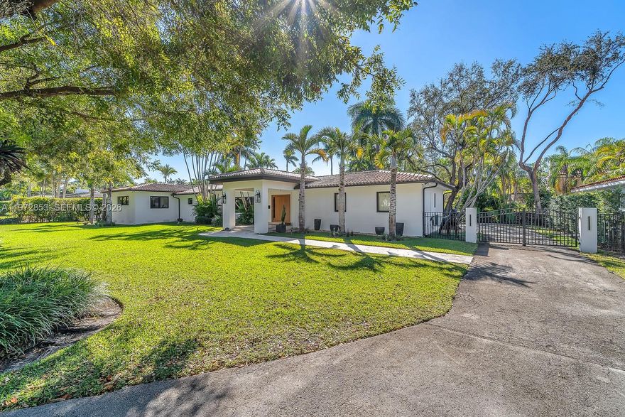 Welcome to Casa Algardi, a magnificent residence nestled on a massive 16,500 square foot parcel on one of Coral Gables’ quiet, tree lined streets. This beautifully updated 3 bedroom 3 bath home has been recently redone with all new flooring, surround sound system, brand new impact windows and doors, and a stunning custom pivot entry door that creates an impressive first impression. The home offers spacious light filled living areas, a modern kitchen with quality finishes and ample cabinetry, generously sized bedrooms including a well appointed primary suite, and a beautiful outdoor veranda overlooking the heated salt water pool, perfect for relaxing or entertaining. A spacious 2 car garage adds convenience and functionality, while the expansive yard is surrounded by lush landscaping offering privacy and tranquility, all just minutes from fine dining, shopping, parks, and top rated schools, making this move in ready residence a rare opportunity in the heart of Coral Gables. Seller will consider property trade or Crypto Currency as well .