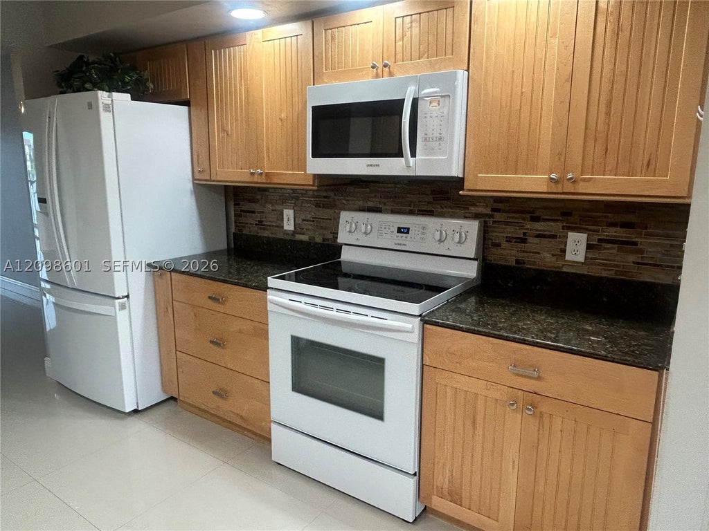 Photo of 571 SW 141st Ave #212N, Pembroke Pines, FL 33027 (MLS # A12098601)