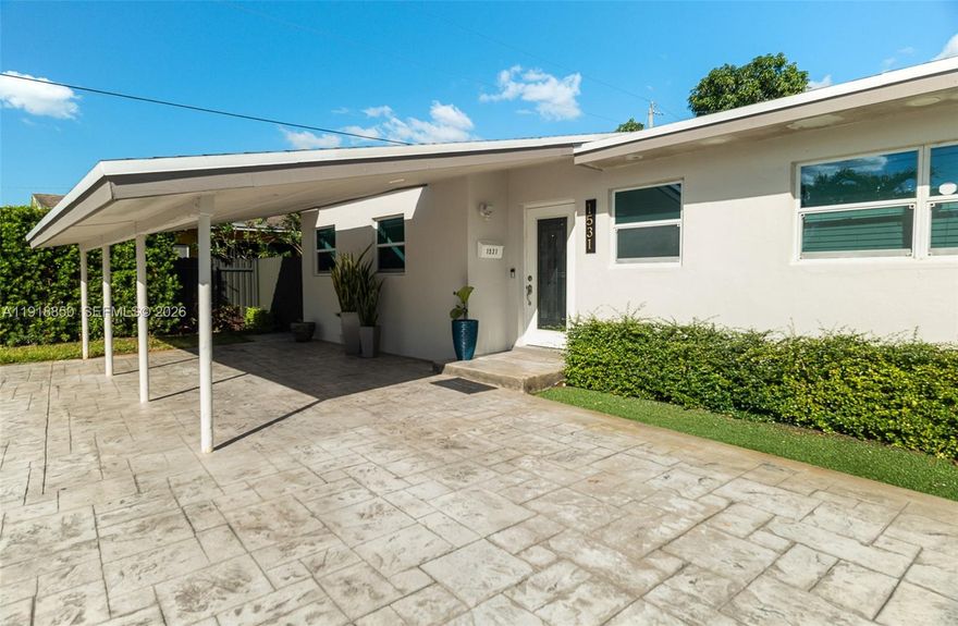 Welcome to 1531 NW 183rd Street, a beautifully updated 3-bedroom, 2-bathroom home in Miami Gardens, ideally located minutes from the Golden Glades Interchange for easy access to I-95, the Turnpike, the Palmetto, and US-441. The property is also just a short drive from the Hard Rock Stadium and Hard Rock Hotel, making it a prime spot for entertainment, events, and year-round activity.

Remodeled in 2019, this home features a new roof, impact windows, and well-maintained finishes throughout. The layout has been thoughtfully divided into two functional living areas. Unit 1 offers the main home with the full kitchen, living room, family room, access to the large landscaped yard, and one bedroom and one bathroom. Unit 2 serves as an efficiency-style in-law suite with a small porch area and its own one bedroom and one bathroom, offering excellent potential for rental income, multigenerational living, or private guest space.

The exterior is beautifully landscaped and includes a large circular driveway and a covered carport, providing ample parking and convenience. Add a well water system that collects rainwater and waters the plants through the homes automated sprinkler systems. 

This is a great opportunity for a savvy buyer seeking flexibility, upgrades, and a highly connected location in an established Miami Gardens neighborhood.