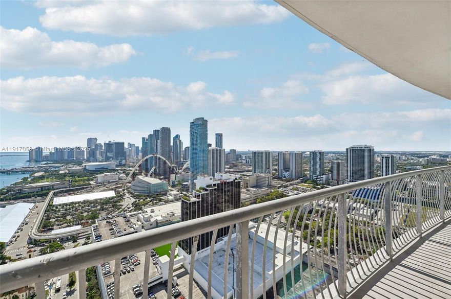 Experience 42nd-floor living with stunning, unobstructed views of Biscayne Bay and the Miami skyline from your full-length balcony. This updated 1-bedroom features new flooring, an open kitchen with stainless steel appliances, in-unit washer/dryer, and a 4-year-old AC. Enjoy resort-style amenities including pool, fitness center, and sauna. HOA covers cable, internet, and water ($1,630/mo, dropping to $990 in Jan 2026). Owner offers $2,000 credit toward HOA, closing, or paint. Steps from Margaret Pace Park, minutes to Wynwood, Brickell, South Beach, and major highways.