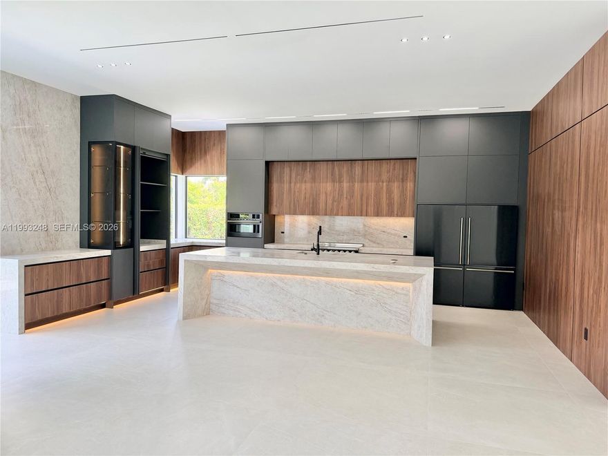 Modern Miami Single Family House. Enjoy luxury features in this beautifully designed house ready to move in. Large patio and lots of Interior sq ft area with 5 bedrooms and 3.5 baths plus a 2 cars Garage. New large modern Pool. Solid layout and open spaces with high ceilings, build with attention to every detail. Swimming area in the pool is 40 ft  long and heated pool, w/ salt system with lots of entertainment area, the spa / hydromassage fits 8 people. New Impact Windows and doors. Security System, large pivot entry door with face recognition opening system. The kitchen is very big and modern. Installed 48x48 Spanish tile flooring this one level house with No HOA and located in one of the most desirable neighborhoods in the area in Miami, Florida. Driveway fits easily 10+ cars. Owner Agent