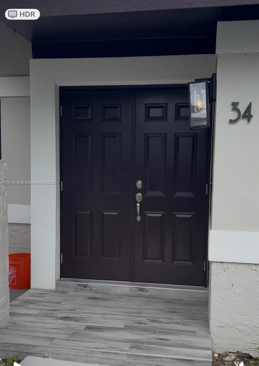 Beautiful and spacious 3-bedroom, 2-bathroom condo located in the sought-after Hammocks community. This bright corner unit offers a functional split floor plan, stylish vinyl flooring throughout, and a spacious living/dining area with access to a private patio—perfect for relaxing or entertaining. The kitchen provides ample cabinet space and natural light. The primary suite includes a walk-in closet and an en-suite bathroom, while the additional bedrooms are generously sized. Enjoy all the amenities that The Hammocks has to offer, including pools, clubhouse, walking/jogging trails, lake access, and more. Conveniently located near shopping, dining, excellent schools, and major highways. Move-in ready!