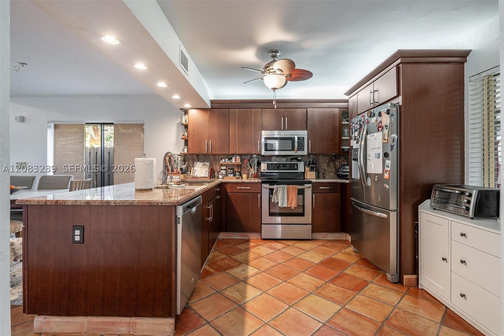 Photo of 1427 SW 109th Way, Davie, FL 33324 (MLS # A12083289)
