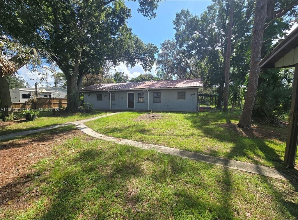 Opportunity knocks on this 1.95-acre in-town property, just ~1 mile from HWY 27 and close to commerce. This 3-bedroom, 2-bathroom home sits on expansive land with room to expand and a private pond at the end of a cul-de-sac. Ready for new owners to revitalize and restore to its original charm, with potential to create your dream project home. Don’t miss this great opportunity—act now.