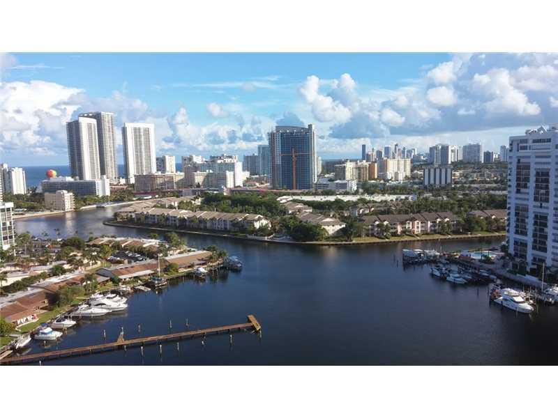great corner unit with close to 1600 sq ft + balcony on Three Islands. Amazing Views! Full amenity bldg.: pool, tennis, concierge, valet, marina and gym. Split bedrooms. Centrally located.