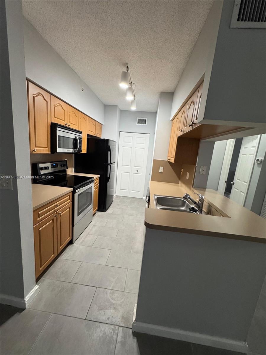 Photo of 11793 W Atlantic Blvd #222, Coral Springs, FL 33071 (MLS # A11869055)
