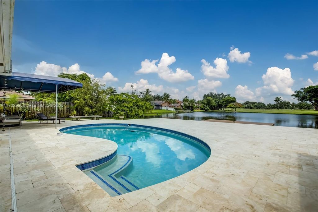 Photo of 9501 Sea Turtle Mnr, Plantation, FL 33324 (MLS # A11702995)
