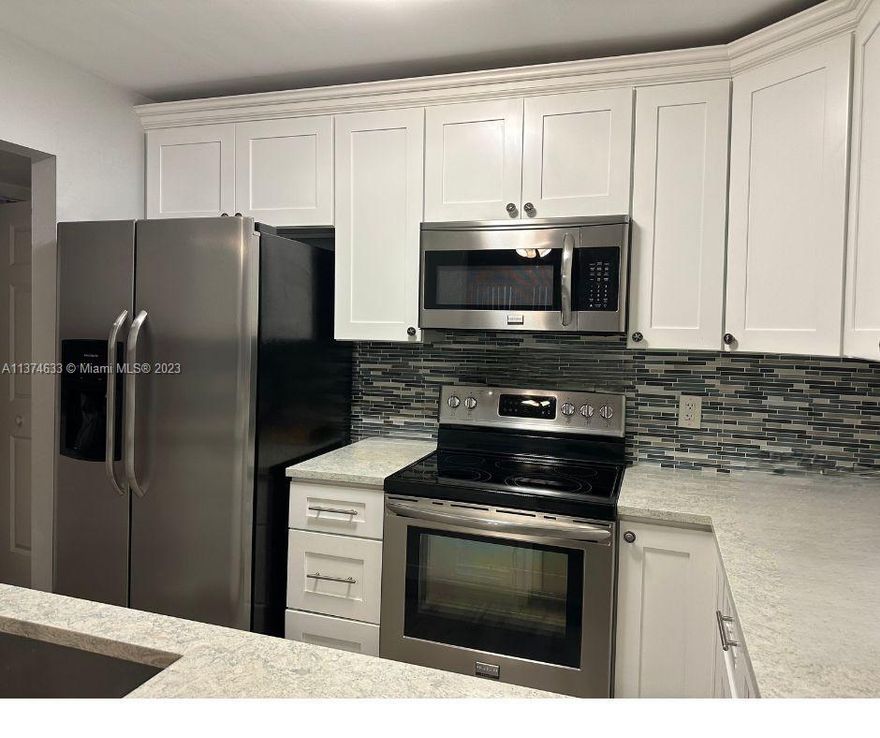 Renovated 1st floor 2/2 home with a 3rd bonus room located in the beautiful sought after French Quarter. Gorgeous kitchen with beach vibes (Montgomery Quartz Cambri), very nice wood tile floor throughout, a peaceful lanai with extra storage, impact windows & slider, and in unit washer and dryer, plus NEW Electric Panel. What more could you ask for? This well-maintained community offers 2 pools, tennis court, clubhouse, BBQ area, car washing area, and ample guest parking. Maintenance includes cable, water, garbage, lawn roof and exterior of bldg. Only HO6 needed. Conveniently located to shopping, highways, parks, golf, dining and more. 20-25% down required. Cash or Conventional loans only. 1 pet 20lbs or less permitted. Pending assessment will be paid in full by Seller prior to closing.