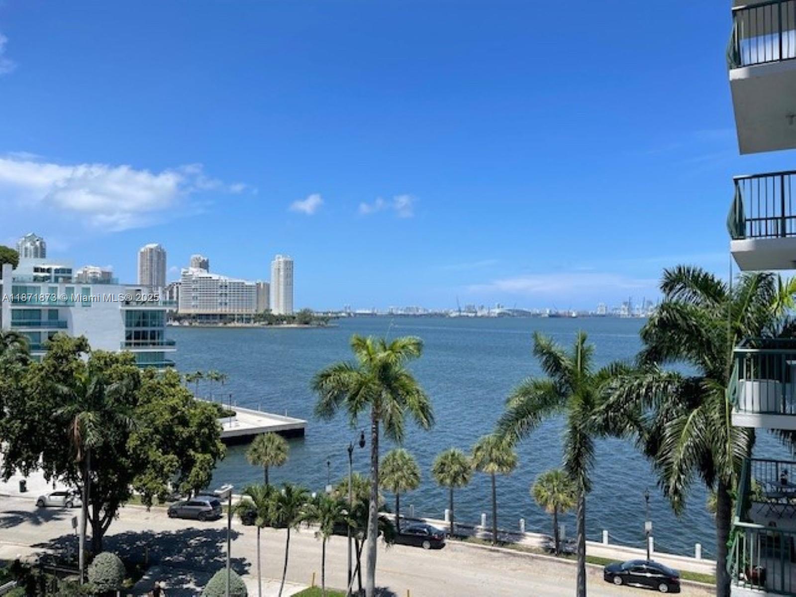 WOW! Just steps to Brickell Avenue Unique and Spectacular 2 story condo with views of Biscayne Bay. Completely renovated with top-of-the-line finishes. This two bedroom & 2.5 bath unit features living areas on the lower floor and bedrooms on the top floor. Two balconies, one on each level with awesome views of bay and surrounding areas. Open-style kitchen with hardwood cabinets and granite tops, stainless steel appliances and stylish lighting. Large living/dining room area with polished travertine marble floors and parlor bathroom. Dramatic architectural finished ceilings add elegance to this wonderful space. Stairs lead to bedrooms upstairs featuring wood laminate floors, walk-in closet and 2 full bathrooms. Washer/dryer in unit. Building amenities include pool, exercise room and more
