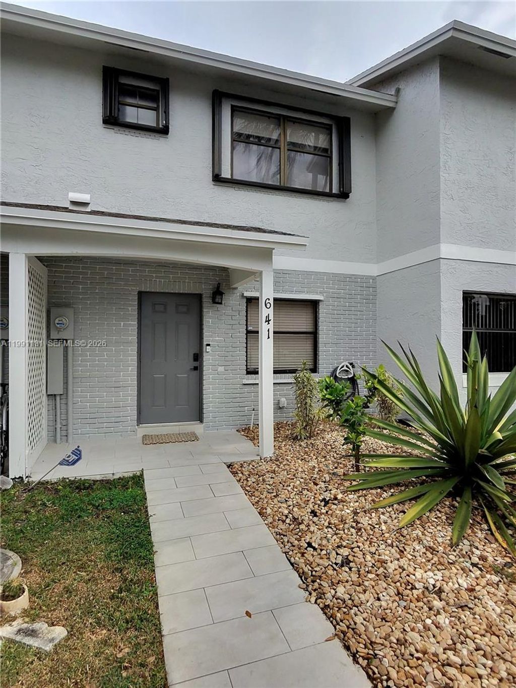 Photo of 641 NW 105th Way #641, Pembroke Pines, FL 33026 (MLS # A11991131)