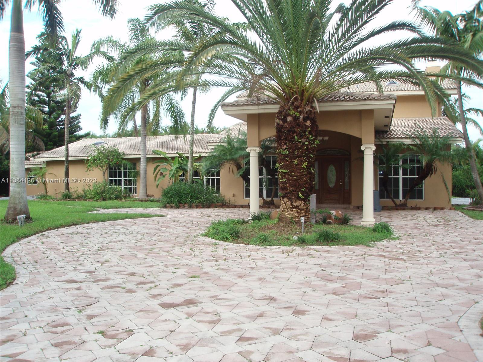 Finest home location in COUNTRY CLUB RANCHES, 2.5 acres of land, cul de sac, corner lot, carport, bridge over fish pond, backyard overlooking waterfront preserve, remote control gate access, completely fenced, gourmet kitchen, reverse osmoses water filtration system, custom wrought iron banisters, separate maids quarters and bathroom, huge 4 car garage or recreational vehicle, boat storage, new paint, new AC, (25,874 Square feet extra on private frontage street, great to parks RV, boats or cars since no neighbors on either side) Underground FPL power lines, way more secure for hurricanes and storms, power more stable then overhead power lines *** E-Z TO SHOW ***
