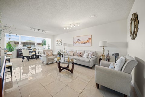 Photo of 8951 Sunrise Lakes Blvd #301, Sunrise, FL 33322 (MLS # A12033958)