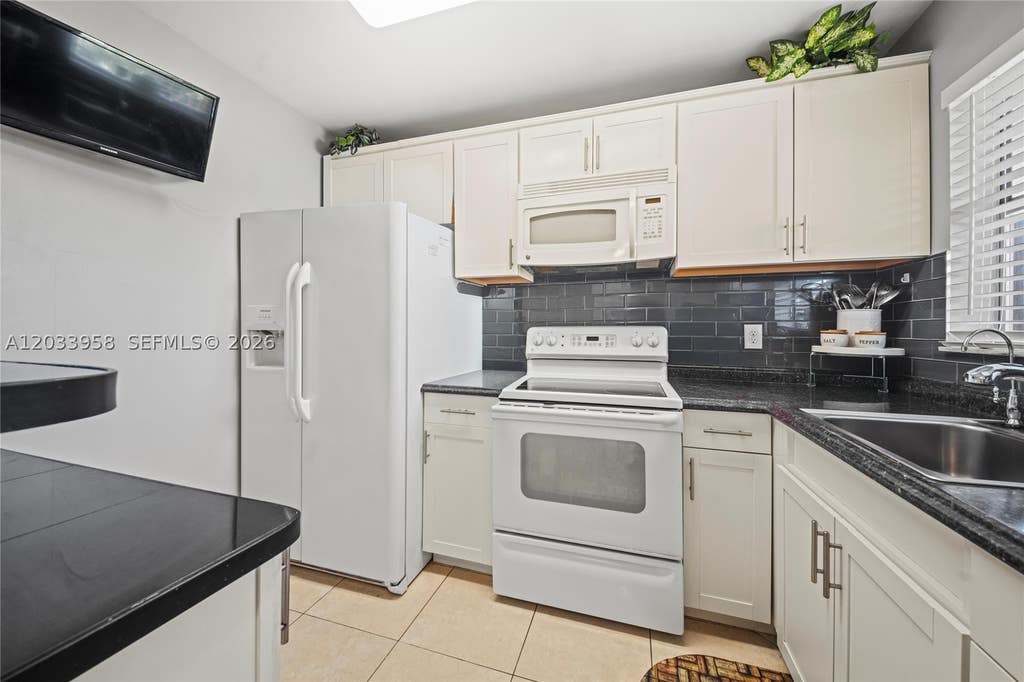 Photo of 8951 Sunrise Lakes Blvd #301, Sunrise, FL 33322 (MLS # A12033958)