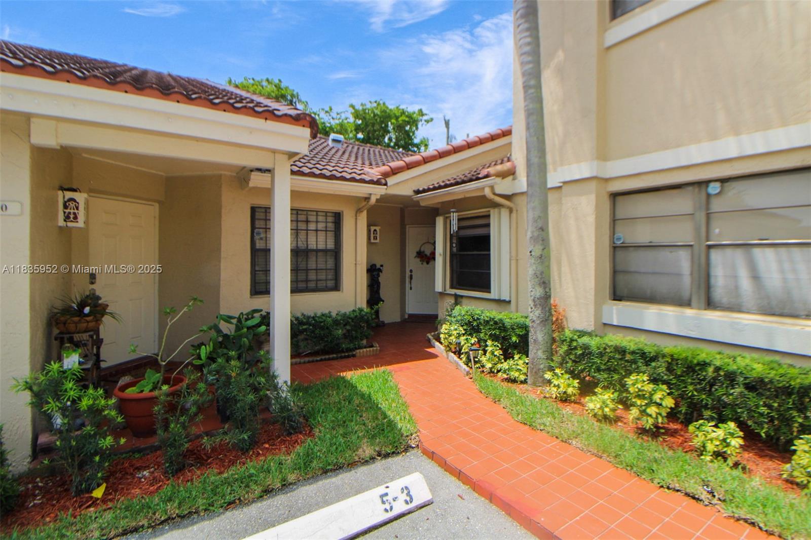 Welcome to this beautifully maintained two-bedroom, two-bath townhome villa nestled in the sought-after community of The Moors, within minutes of Miami Lakes This spacious residence features a bright, open floor plan that seamlessly blends comfort and functionality. The modern kitchen offers ample cabinet space and sleek appliances, ideal for everyday cooking and casual dining. Both bedrooms are generously sized, each with walk-in closets and custom built-in organizers for optimal storage. Step outside to your private rear patio perfect for morning coffee or relaxing evenings. Enjoy the peace of a gated community with access to great amenities, all while being close to top schools, shopping, and major highways.